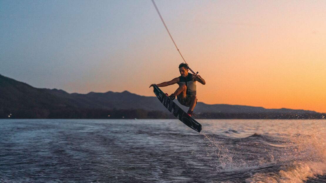 Golden hour, a clean wake, and a wakeboarder who's not ready to call it a day on Okanagan Lake.